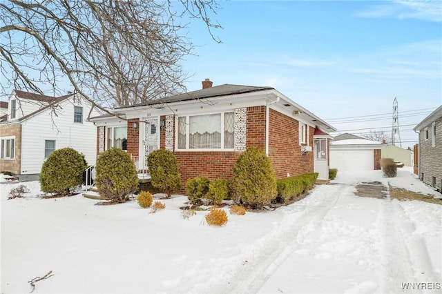 view of front of home featuring an outbuilding and a garage