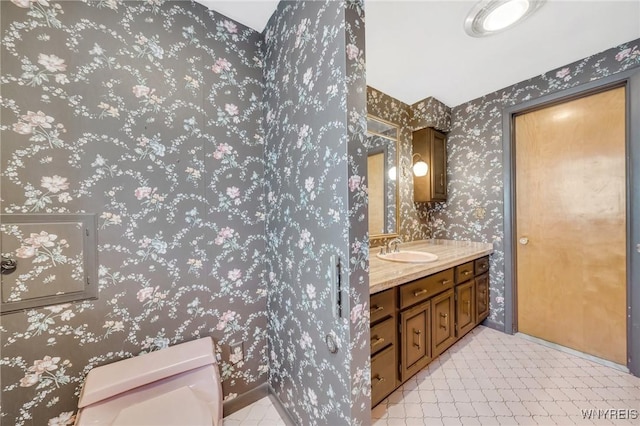 bathroom featuring vanity and toilet