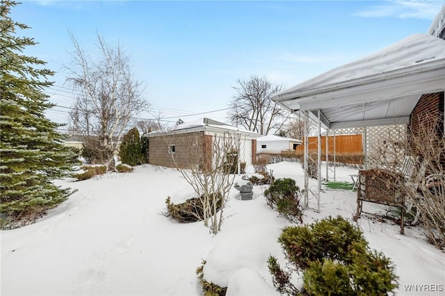 view of yard covered in snow