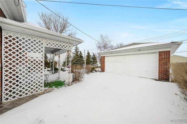 view of snow covered garage