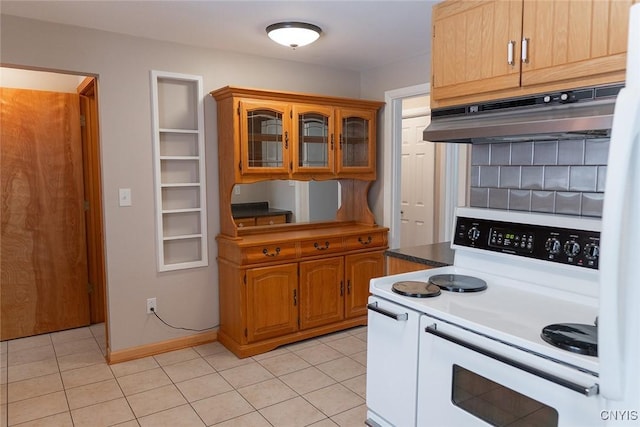 kitchen featuring light tile patterned floors and white range with electric stovetop