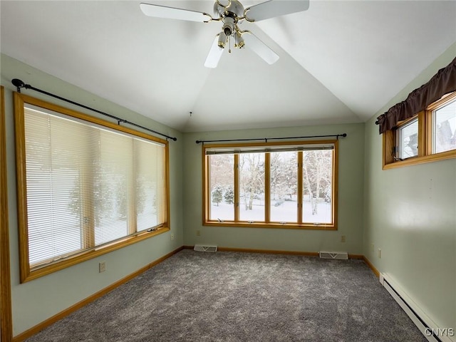 carpeted spare room featuring lofted ceiling and a baseboard heating unit