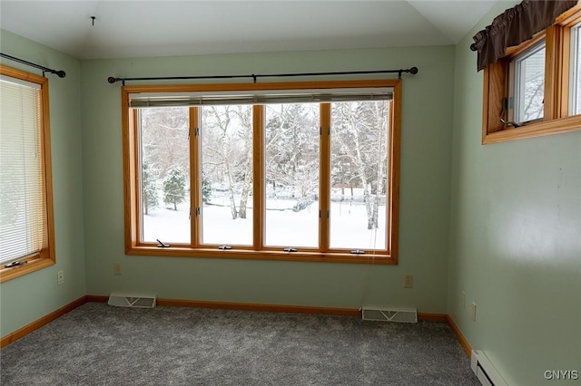 carpeted empty room with lofted ceiling and baseboard heating