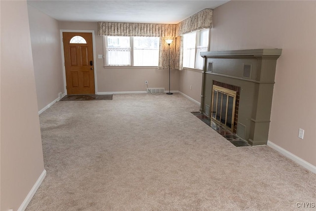 unfurnished living room with light carpet