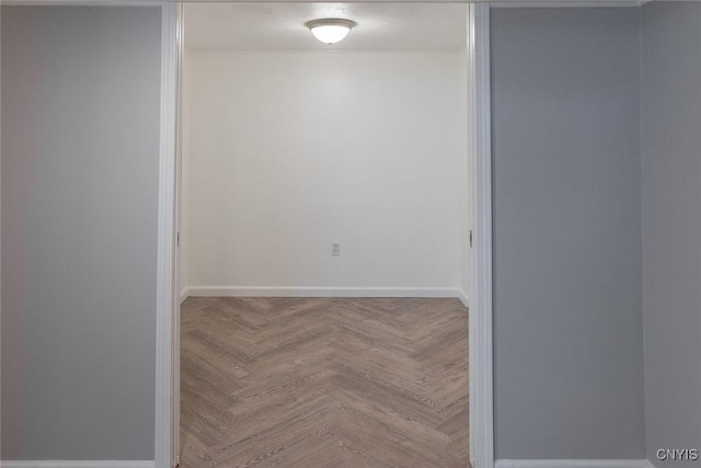 empty room featuring parquet flooring