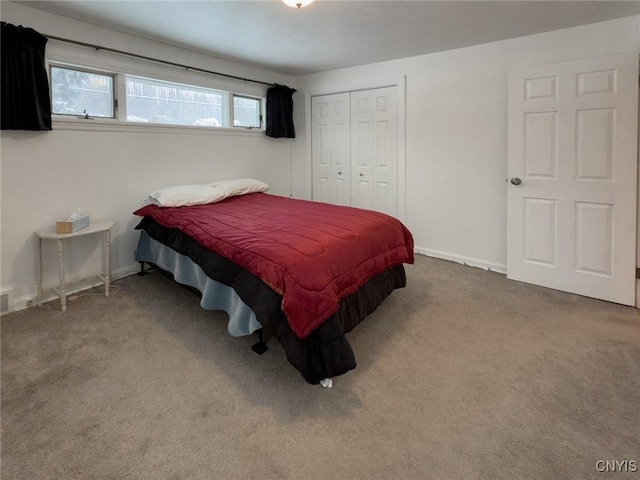 bedroom with a closet and carpet