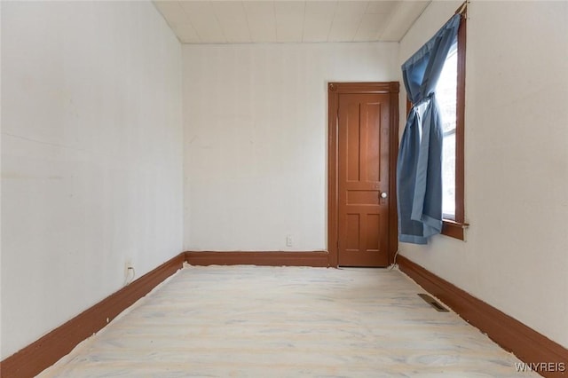 empty room with hardwood / wood-style floors