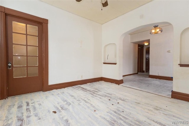 unfurnished room with ceiling fan and light wood-type flooring