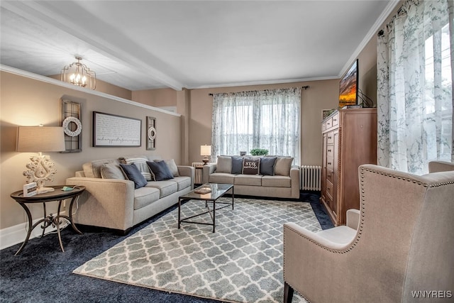 living room featuring ornamental molding, radiator, and a notable chandelier