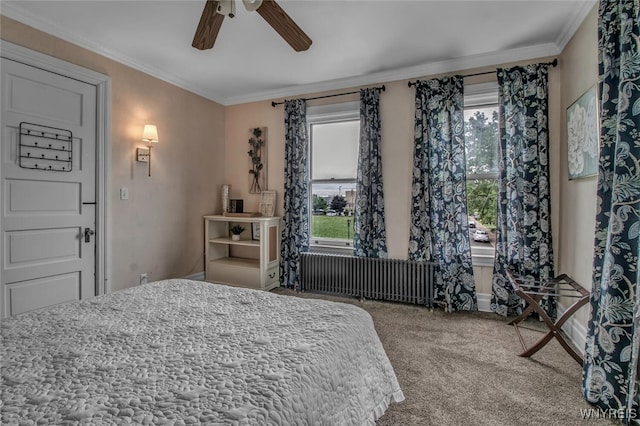 carpeted bedroom featuring ornamental molding, radiator, and ceiling fan