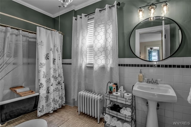 bathroom with ornamental molding, radiator, tile walls, and toilet