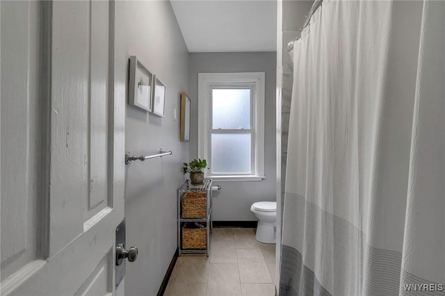 bathroom featuring tile patterned floors and toilet