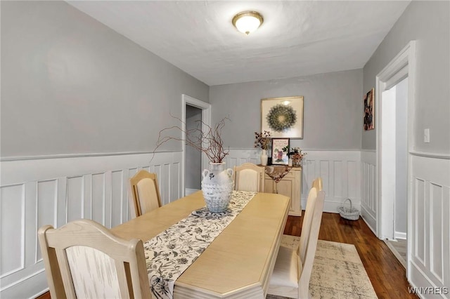 dining space featuring dark hardwood / wood-style flooring