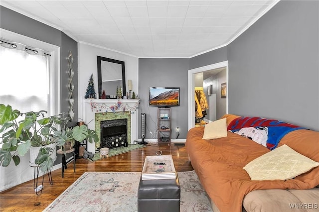 living room with dark wood-type flooring and ornamental molding