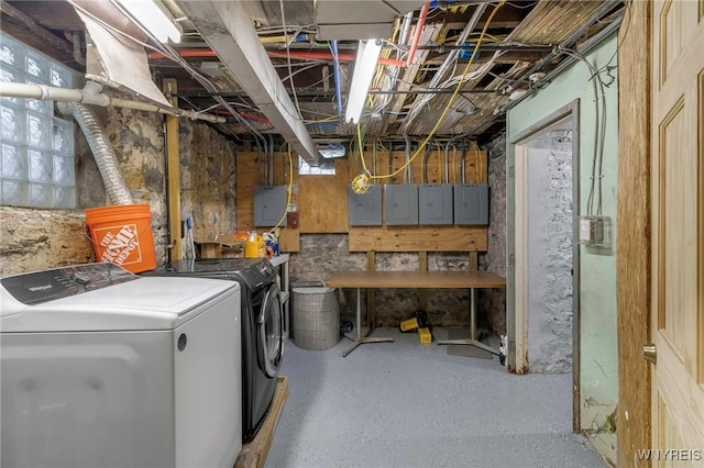 washroom featuring electric panel and separate washer and dryer