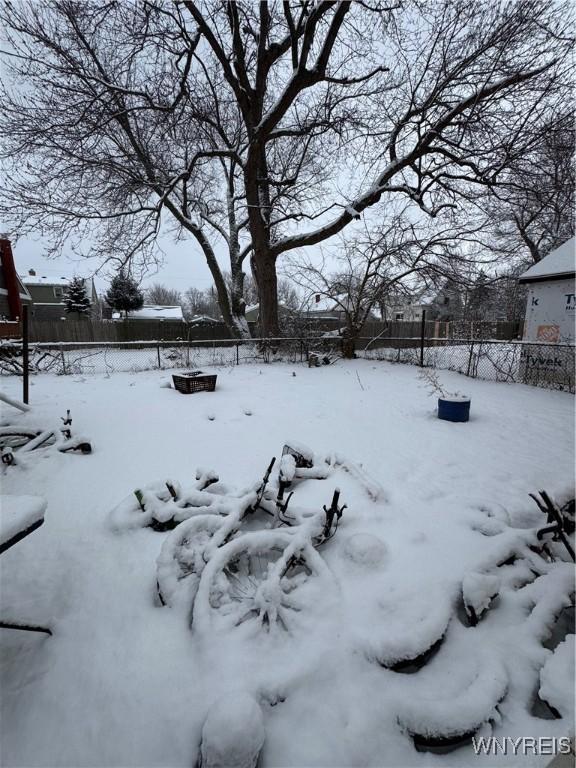 view of yard covered in snow