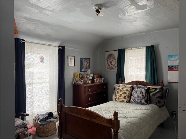 bedroom with lofted ceiling