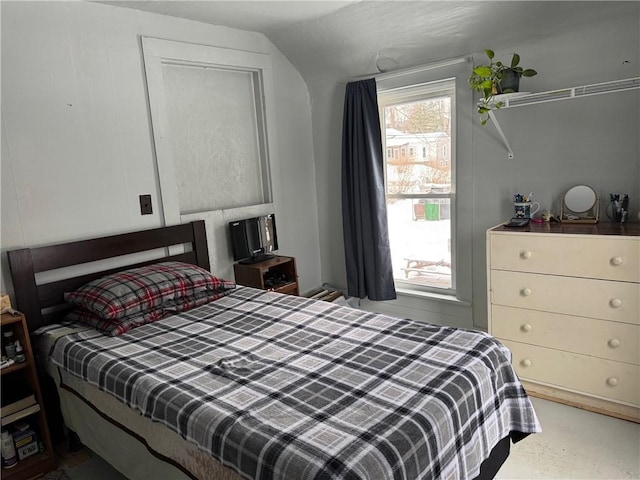 bedroom with lofted ceiling