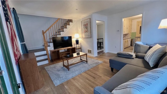 living room with light hardwood / wood-style flooring