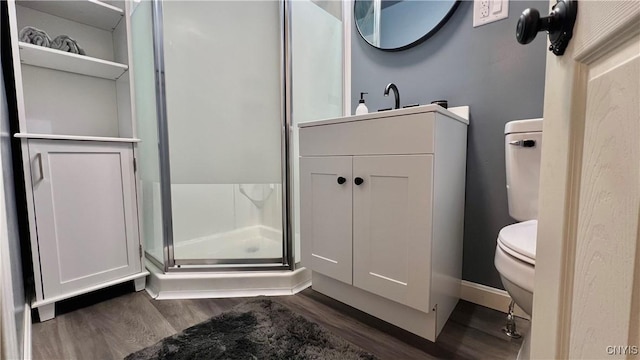 bathroom with vanity, an enclosed shower, hardwood / wood-style flooring, and toilet