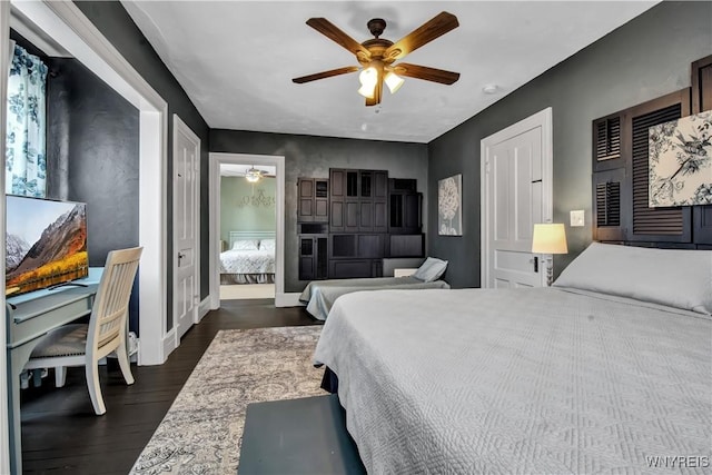 bedroom with ceiling fan and dark hardwood / wood-style floors