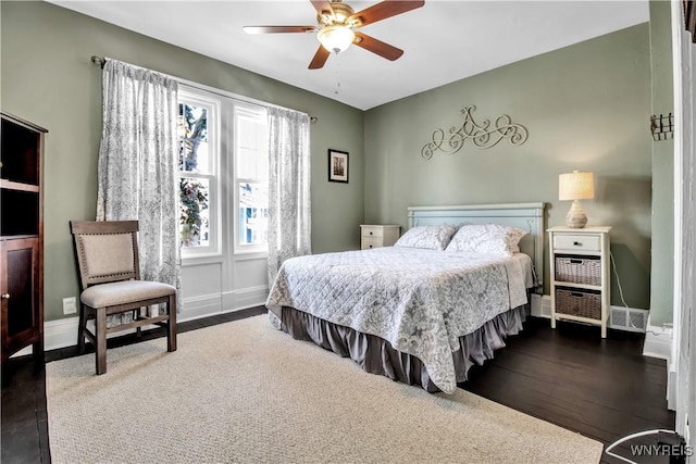 bedroom featuring dark hardwood / wood-style floors and ceiling fan