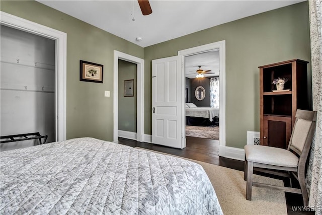 bedroom featuring ceiling fan and dark hardwood / wood-style flooring