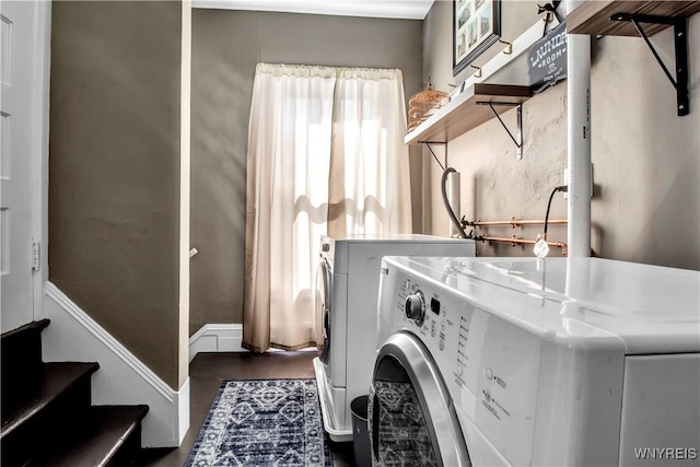 laundry area featuring washing machine and clothes dryer