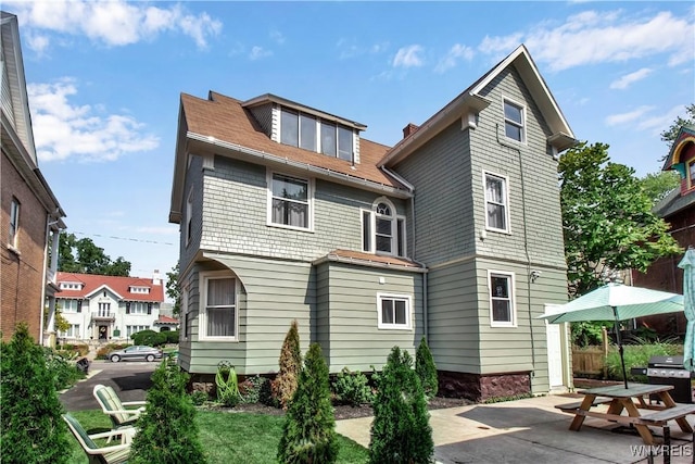 rear view of property with a patio area