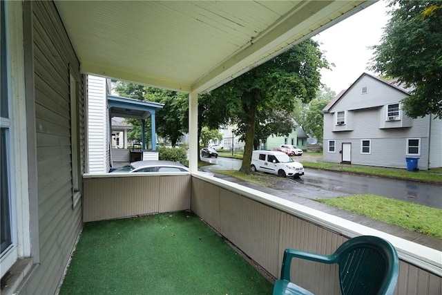 balcony featuring a porch