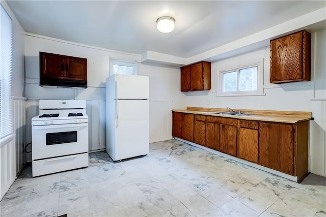 kitchen with white appliances and sink