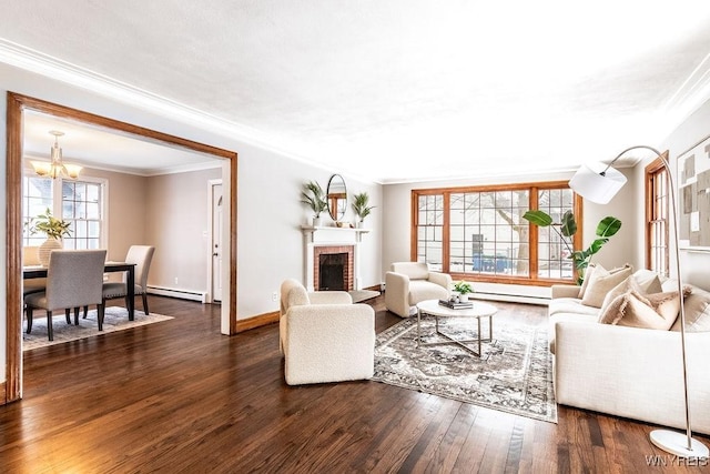 living room featuring dark hardwood / wood-style flooring, plenty of natural light, a baseboard heating unit, and a fireplace