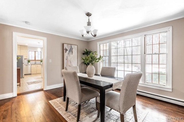 dining area featuring an inviting chandelier, crown molding, a baseboard radiator, and dark hardwood / wood-style floors