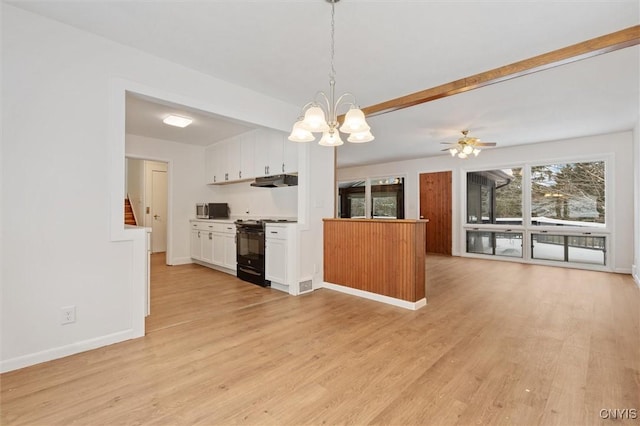 kitchen featuring black range with gas cooktop, light wood-style flooring, white cabinets, ventilation hood, and stainless steel microwave