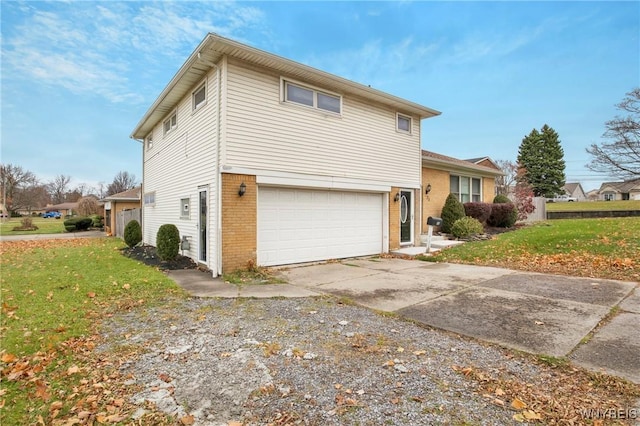 exterior space with a garage and a yard