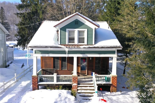 view of front of property featuring covered porch