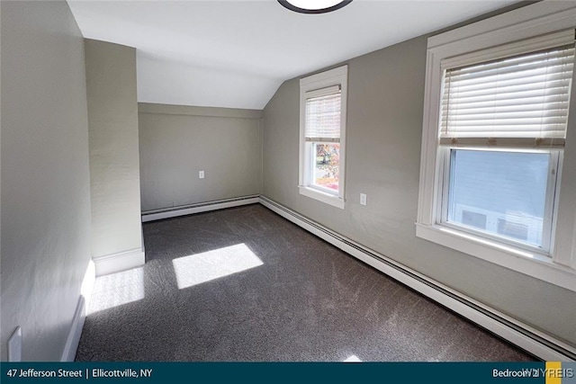 bonus room featuring lofted ceiling, carpet flooring, and baseboard heating