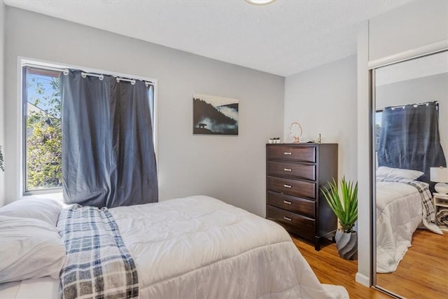 bedroom featuring light wood-type flooring