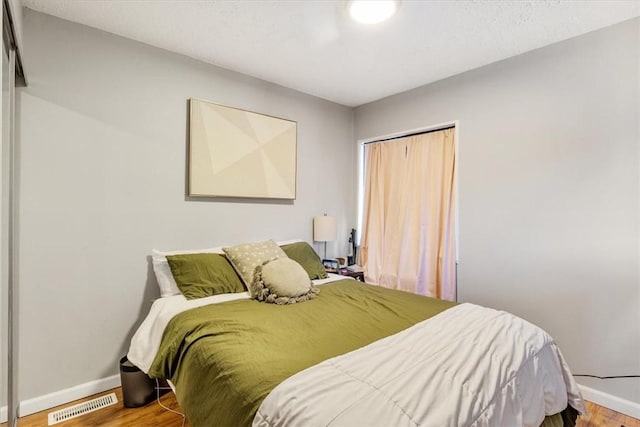 bedroom featuring wood-type flooring