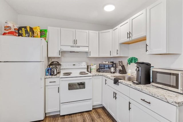 kitchen featuring white appliances, dark hardwood / wood-style floors, and white cabinets