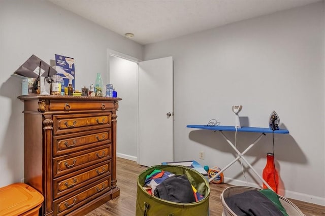 game room with hardwood / wood-style floors