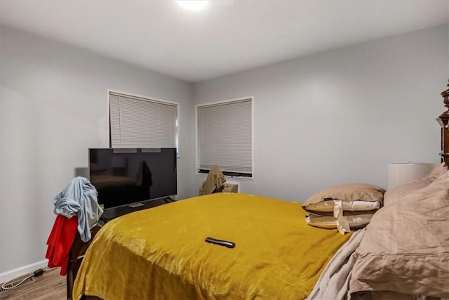 bedroom featuring wood-type flooring