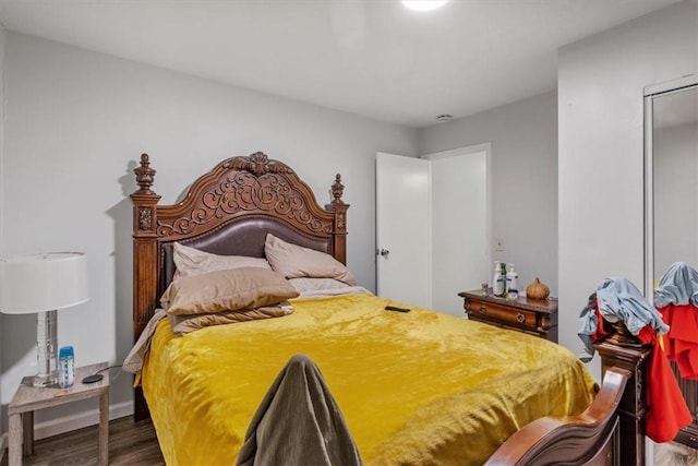 bedroom with hardwood / wood-style floors