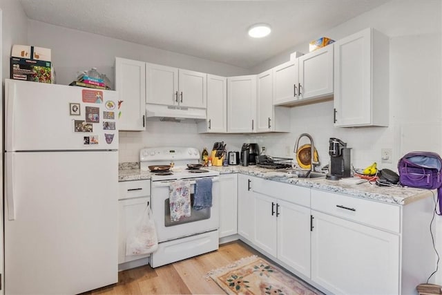 kitchen with white cabinetry, sink, backsplash, light hardwood / wood-style floors, and white appliances