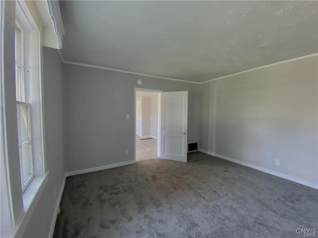 carpeted empty room with ornamental molding