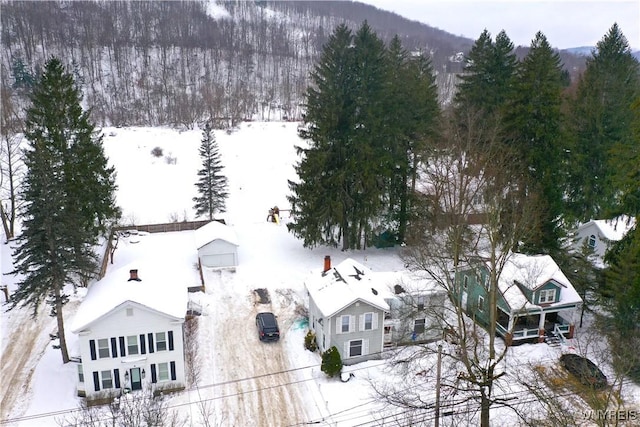 snowy aerial view featuring a mountain view