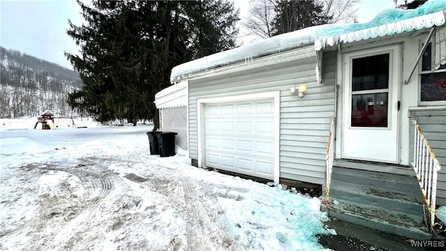 view of snow covered garage