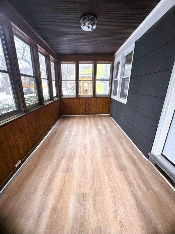 unfurnished sunroom featuring wooden ceiling