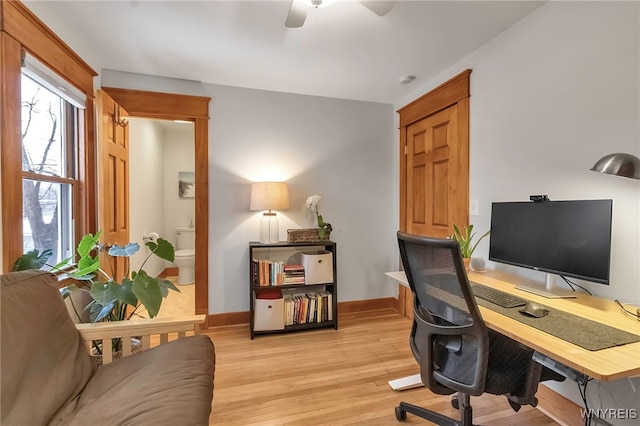 home office with ceiling fan and light wood-type flooring