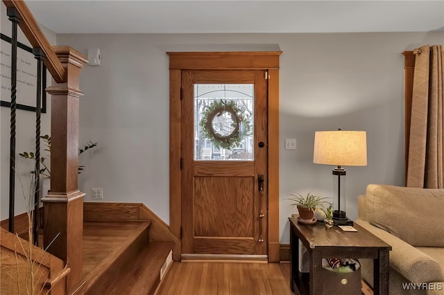 entryway with light hardwood / wood-style floors